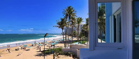 On the beach, sun loungers, beach towels