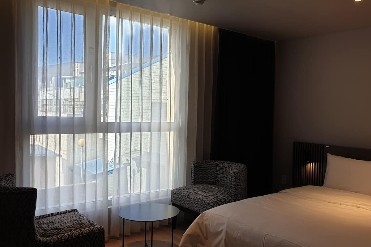 Premium bedding, pillow-top beds, desk, laptop workspace