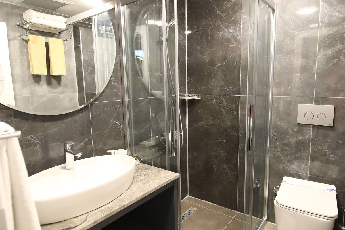 shower, rainfall showerhead, hair dryer, slippers