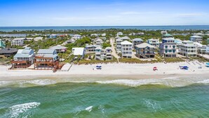 A coastal residential area with beachfront properties, including houses with balconies and beach access. - Vitamin Sea - Gulf Front, Pet Friendly, Wifi, Sleeps 6 (Port St Joe)