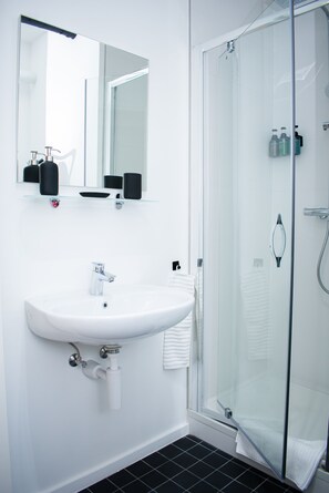 Combined shower/tub, hair dryer, towels, soap