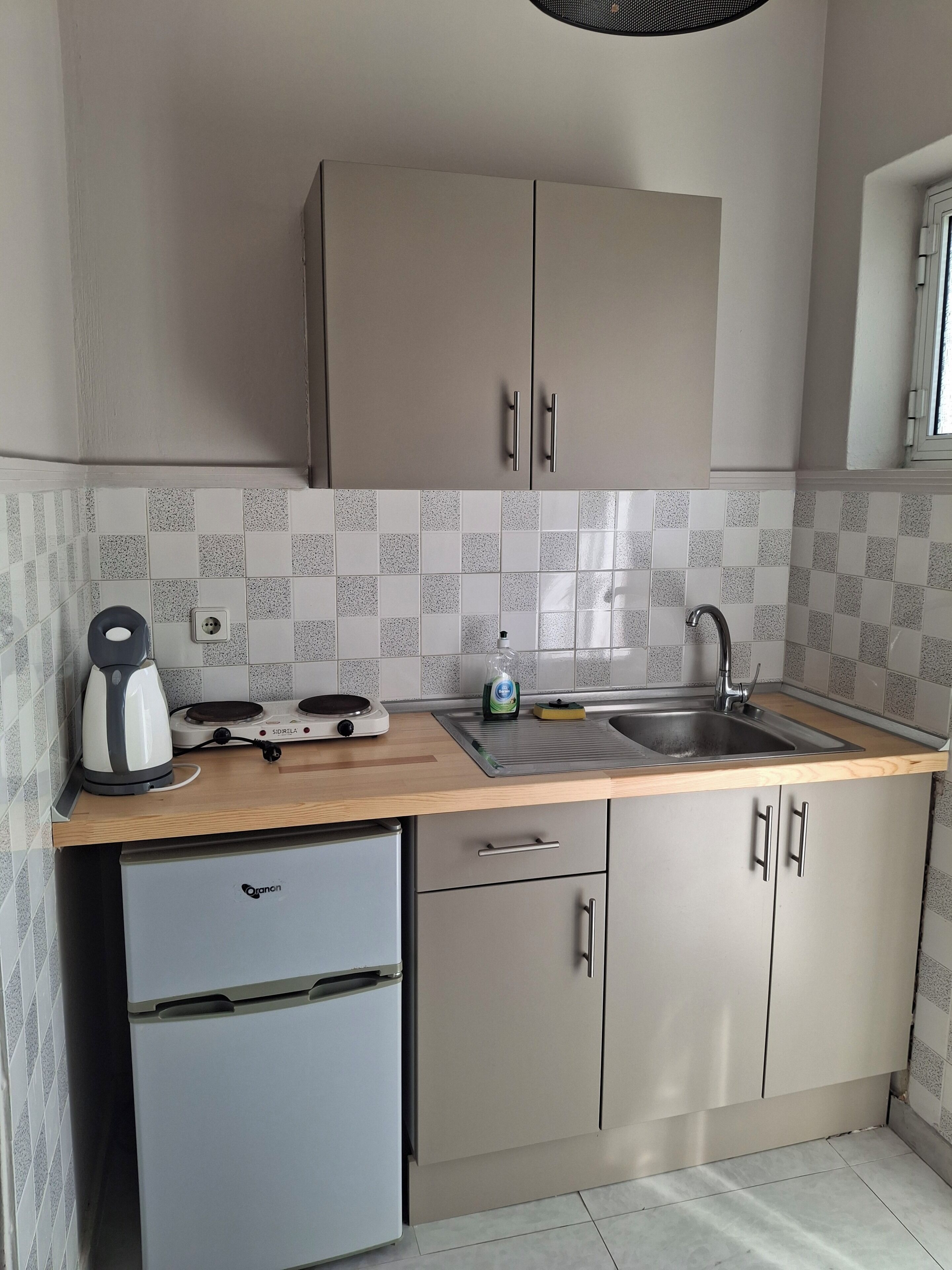 Mini-fridge, cookware/dishes/utensils, paper towels