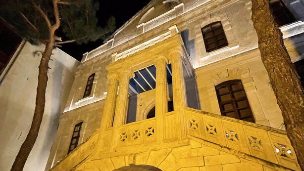 A historic building with a stone facade, a central arched entrance, and a balcony with decorative railings. - Thrace Konak Hotel & Spa (Kirklareli)
