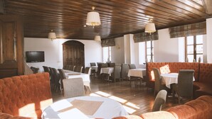 A spacious dining area with wooden ceilings, multiple tables, and cushioned seating. - Thrace Konak Hotel & Spa (Kirklareli)