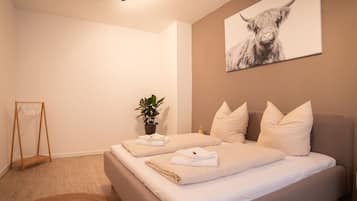 3 habitaciones, tabla de planchar con plancha y cuna de viaje