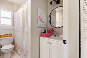 Combined shower/tub, hair dryer, towels, soap