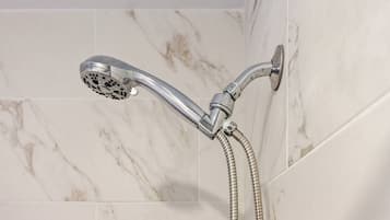 Combined shower/tub, hair dryer, towels, soap