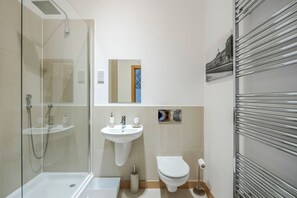 Shower, hair dryer, towels, shampoo