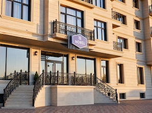 A multi-story hotel with a prominent sign reading 'NOBEL HOTEL'. - Nobel Hotel (Baku)