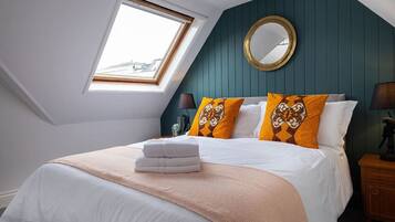 1 bedroom, desk, iron/ironing board, travel crib