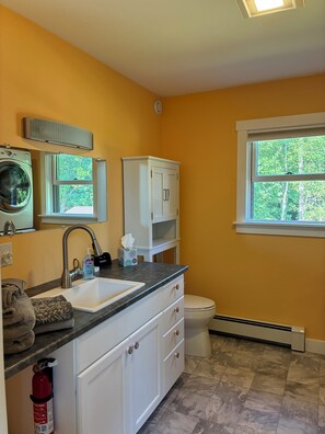 Bathtub, hair dryer, towels, soap