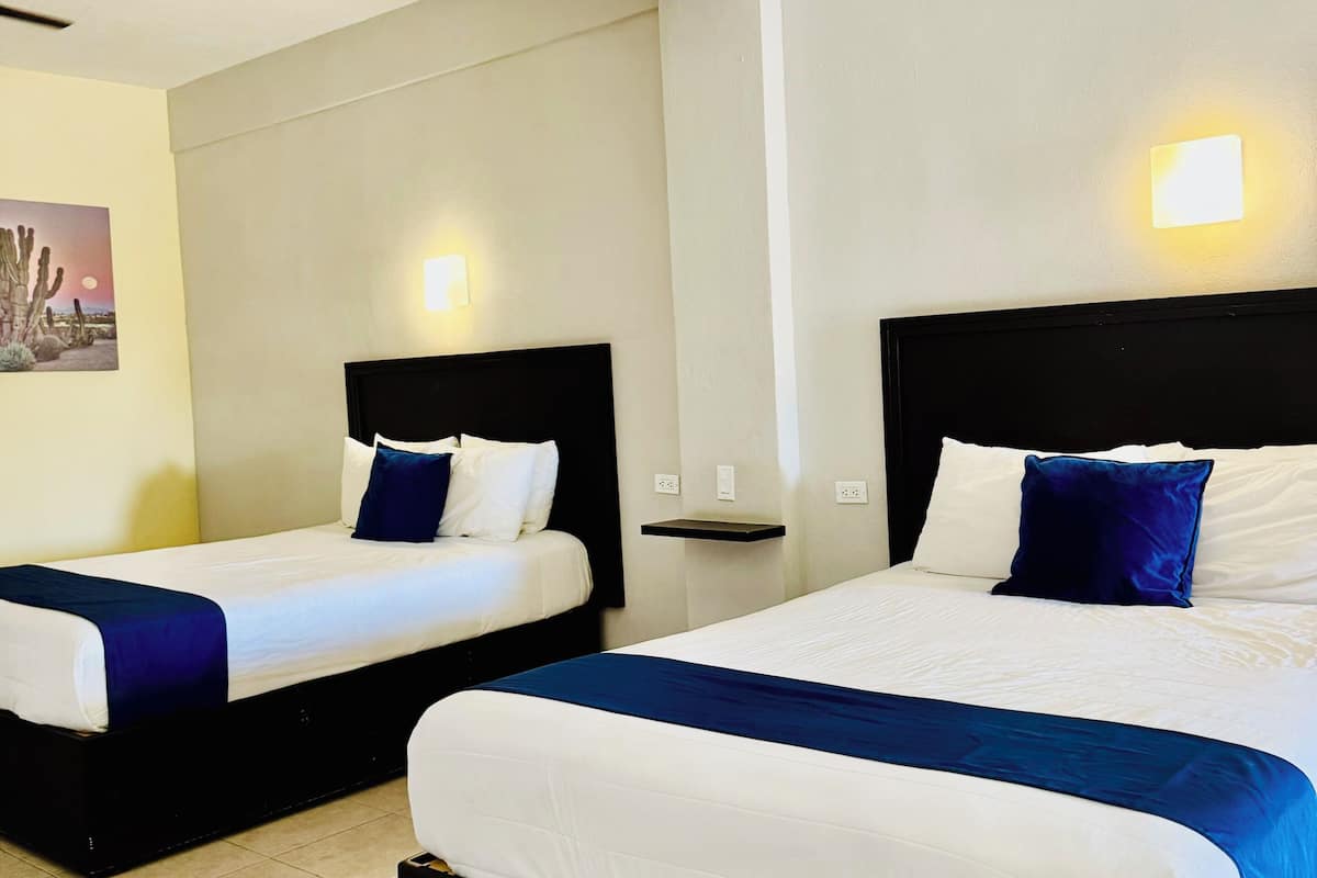 family room, 2 double beds | desk, iron/ironing board, free wifi, bed sheets