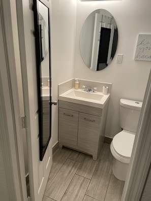 Bathtub, hair dryer, towels, soap