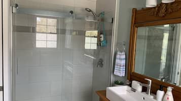 Shower, hair dryer, towels, soap