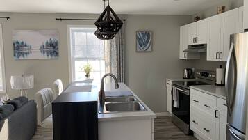 Coffee/tea maker, fridge, microwave, oven
