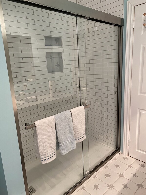 Shower, hair dryer, towels, soap