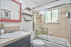 Bathtub, towels, soap, shampoo
