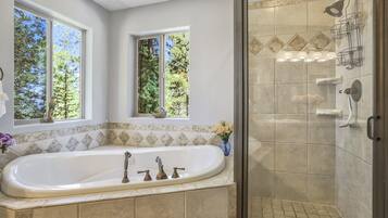 Bathtub, towels, soap, shampoo