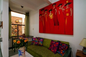 Standard Room, 1 King Bed, Kitchen, Courtyard View | Living area | 20-inch flat-screen TV with cable channels, TV