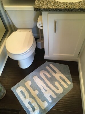 Combined shower/tub, hair dryer, towels, soap