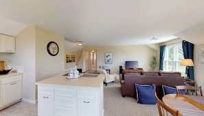 A spacious living area with a dining table, a sofa, and a television. - 1 Bdrm Pet friendly Rental/ Walkable to Village (Skaneateles)