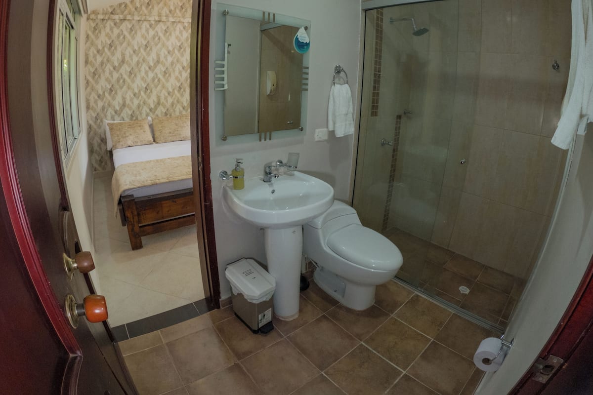 Basic Triple Room | Bathroom | Shower, rainfall showerhead, towels, soap