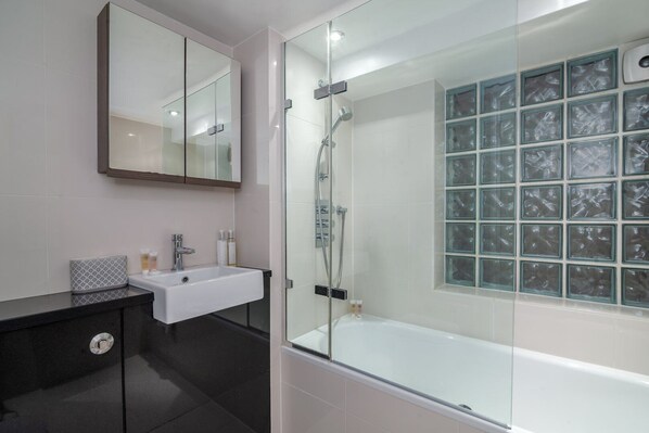 Bathtub, hair dryer, towels