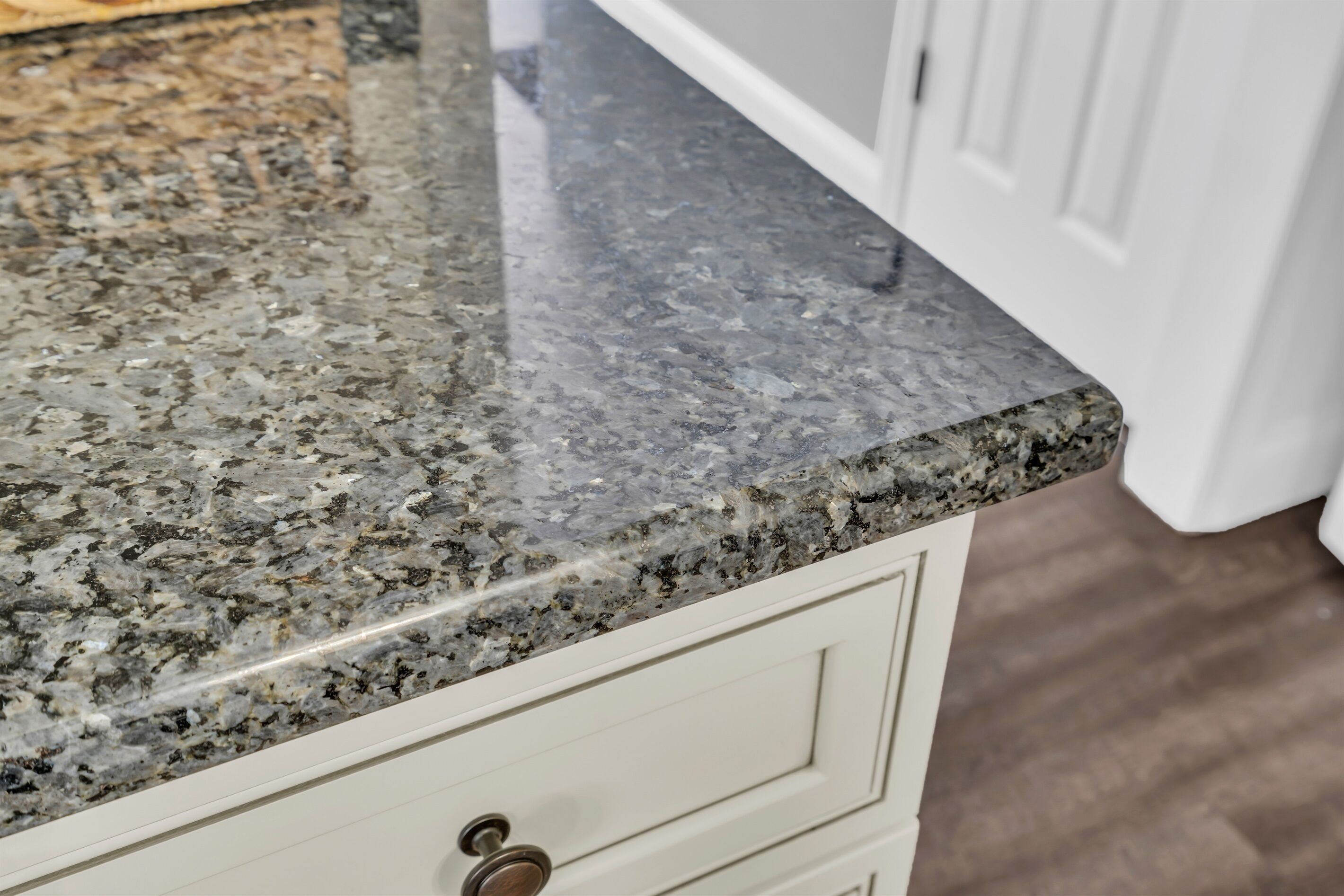 A kitchen countertop with a granite finish.
