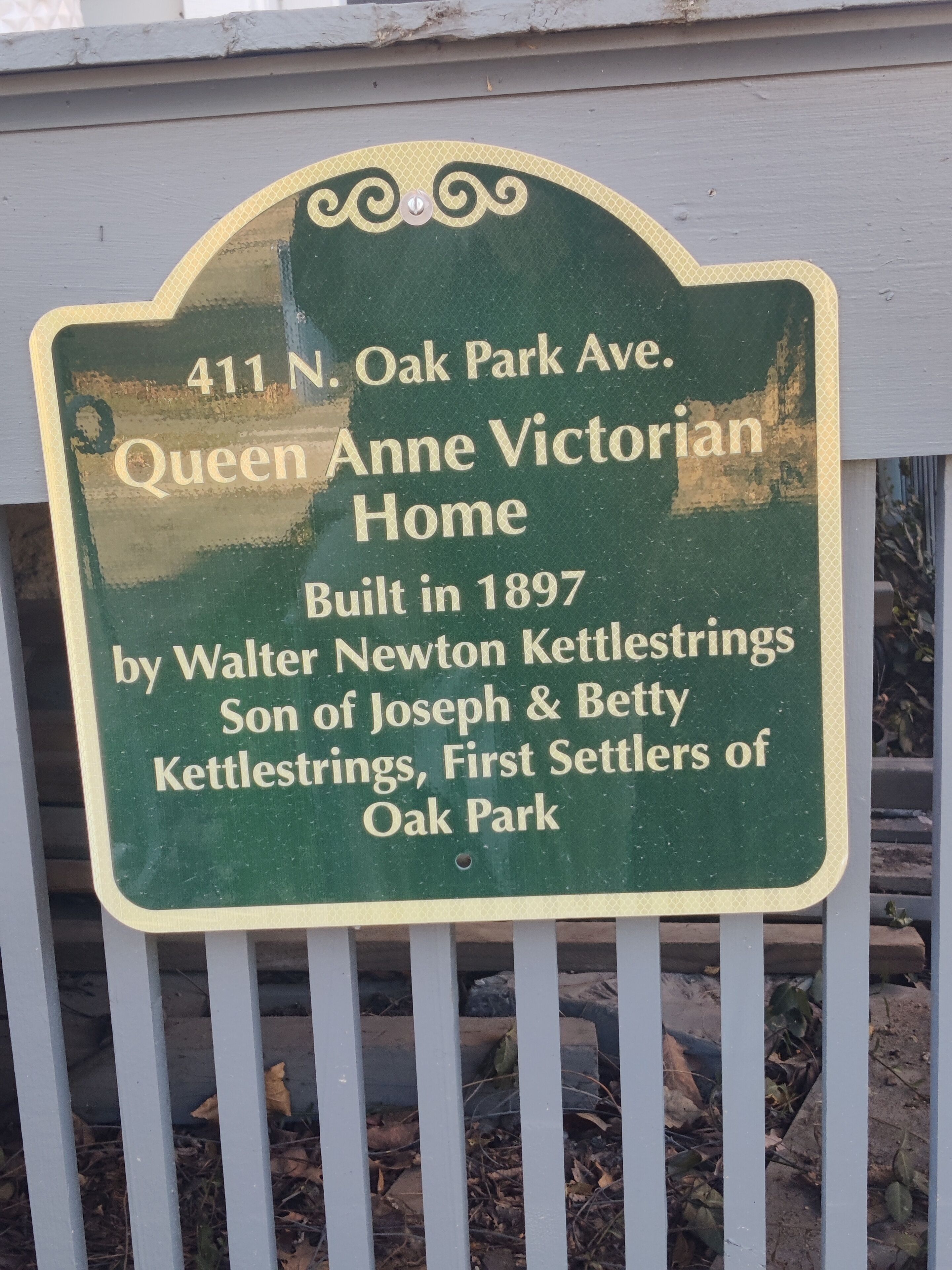 A historical marker sign for the Queen Anne Victorian Home at 411 N. Oak Park Ave., built in 1897 by Walter Newton Kettlestrings, son of Joseph & Betty Kettlestrings, first settlers of Oak Park.