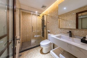 A modern bathroom with a glass-enclosed shower, a white sink, and a large mirror. - Yunji Hotel (Guangzhou Olympic Sports Center Dongpu Metro Station Branch) (Guangzhou)