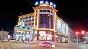 A multi-story hotel with a prominent sign reading "Continental Hotel". - Wuzhou Hotel (Yongchang)