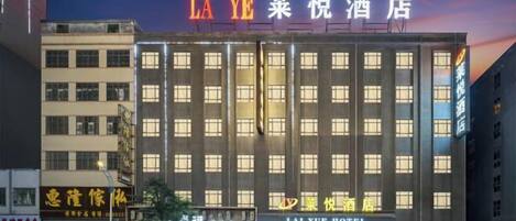 Stylish hotel with a modern architectural design and symmetrical facade.