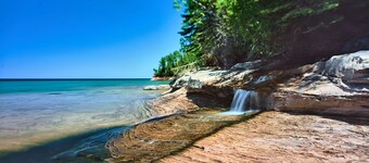 Rock House-Downtown Munising with Private Patio, Garage, Fire-pit & BBQ Grill