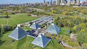 A large solar farm with multiple pyramidal structures. - Chic Suite - Long Stays - King Bed  - Fireplace &WiFi
 (Edmonton)