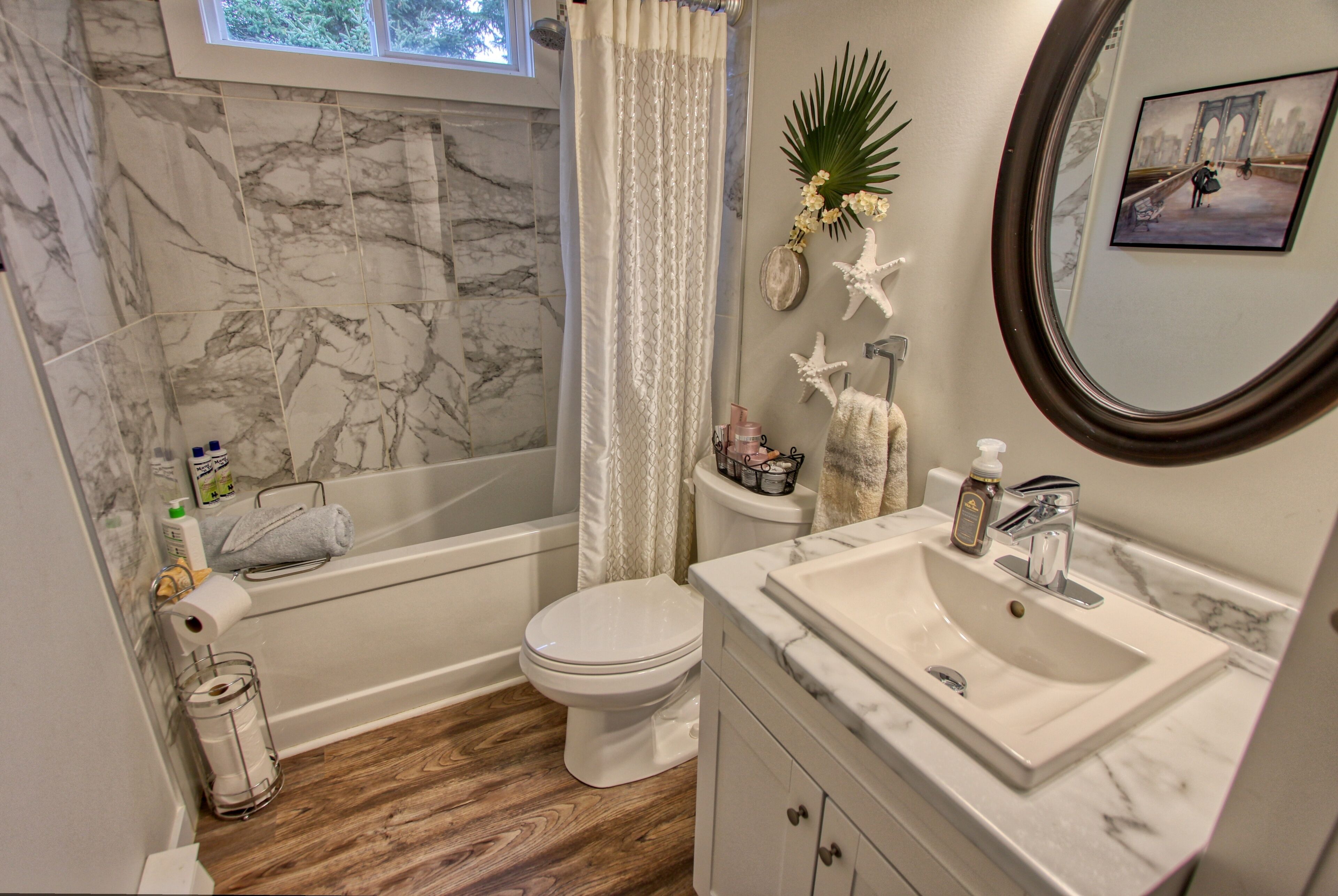 Combined shower/tub, hair dryer, towels, soap