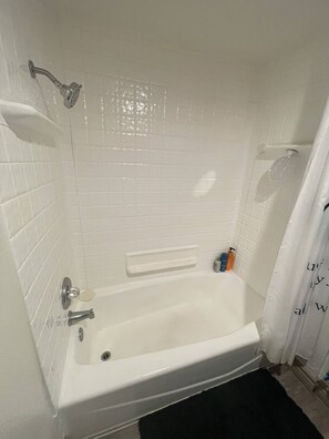Combined shower/tub, hair dryer, soap, toilet paper