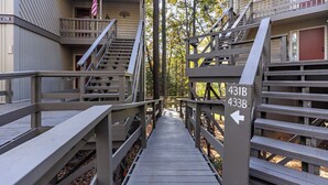 A wooden bridge connecting two buildings with balconies and a sign indicating room numbers 431B and 433B. - Hiking Trails, Wood-Burning Fireplace & Community Pools - Buckanoe Condo (Jasper)