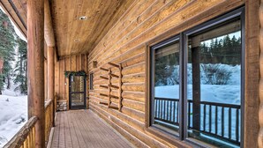 A wooden log cabin with a wooden deck, large windows, and a view of a snowy landscape. - 9 Mi to Slopes! Hot Tub Hideaway in Breckenridge (Breckenridge)