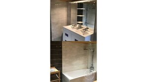 Bathtub, hair dryer, towels, toilet paper