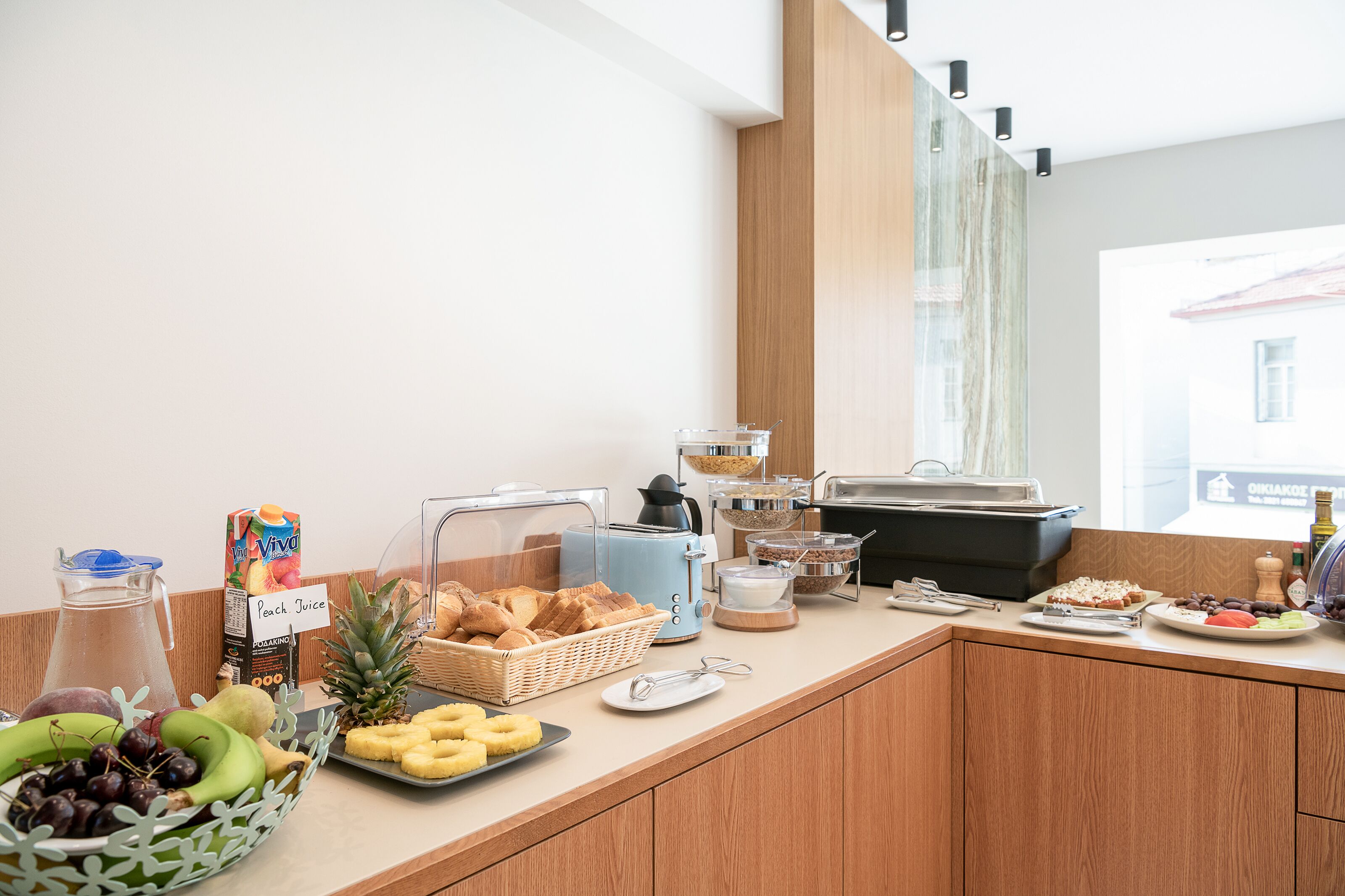 A breakfast buffet with various food items and beverages.