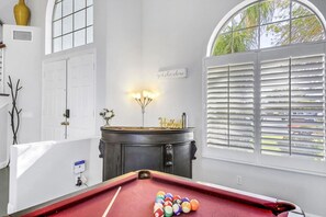 A pool table with balls, a decorative lamp, and a sign that reads 'welcome'. - Terra Azul: Pool, Spa, Billiard Table, Foosball (Indio)