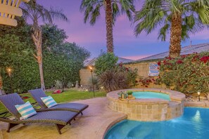 A backyard with a hot tub, lounge chairs, and a swimming pool. - Terra Azul: Pool, Spa, Billiard Table, Foosball (Indio)