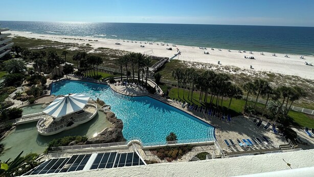 A resort with a large pool, a water slide, and a beach. - Gulf Front Condo with Stunning Views! (Pensacola)