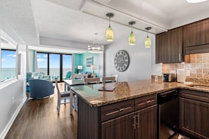 Enjoy meals in the kitchen, which offers a dining area with a table and chair.