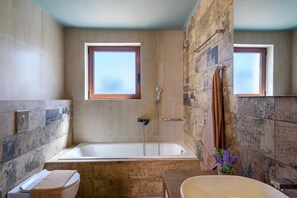 Combined shower/tub, hair dryer, towels, soap