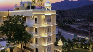 A multi-story hotel with a sign reading 'MEWAR PALACE' and a pool area. - Mewar Palace Luxury Resort & Private Pool Villas - Udaipur (Udaipur)