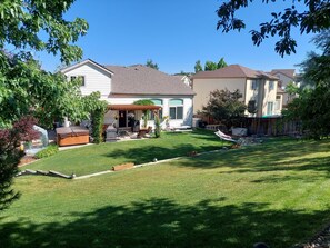A residential backyard with a patio, barbecue grill, and outdoor furniture. - Updated home near the Air force Academy (Colorado Springs)