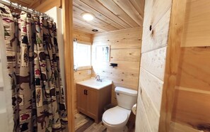Combined shower/bathtub, toilet paper - Cabin 10 at Green Valley Resort on Seventh Crow Wing (Nevis)