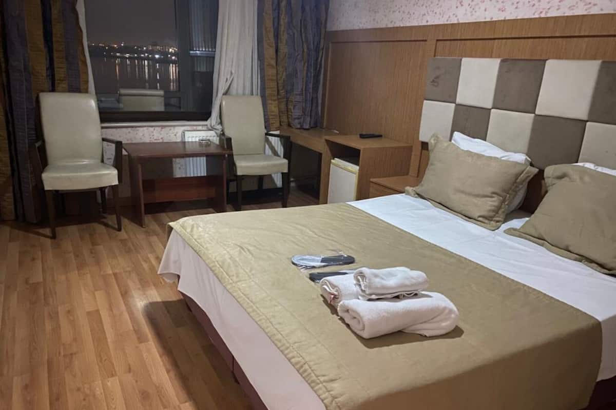 Premium bedding, down duvets, in-room safe, desk