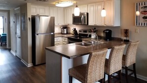 Coffee/tea maker, fridge, microwave, oven